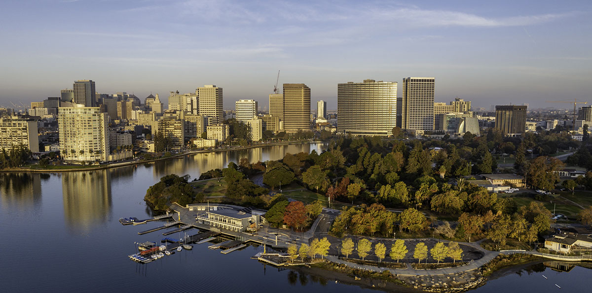 Aerial photo of downtown Oakland California and Lake Merritt early in the morning at sunrise.